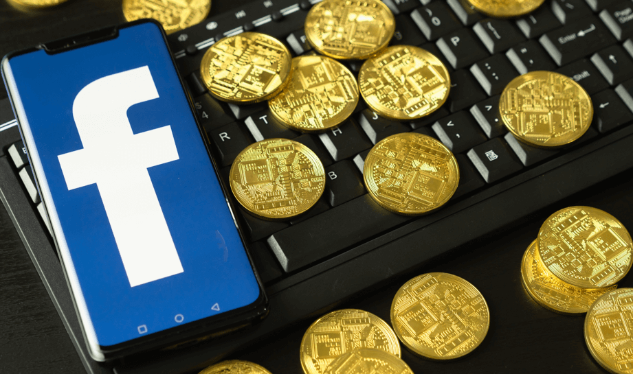 Celular com Logotipo do Facebook e moedas douradas em volta